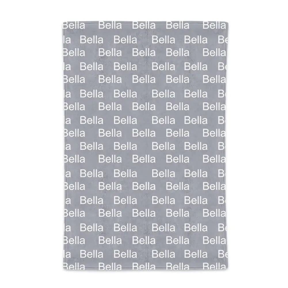 Gray blanket featuring Bella text pattern, perfect for infants, in pink, purple, and fuchsia.