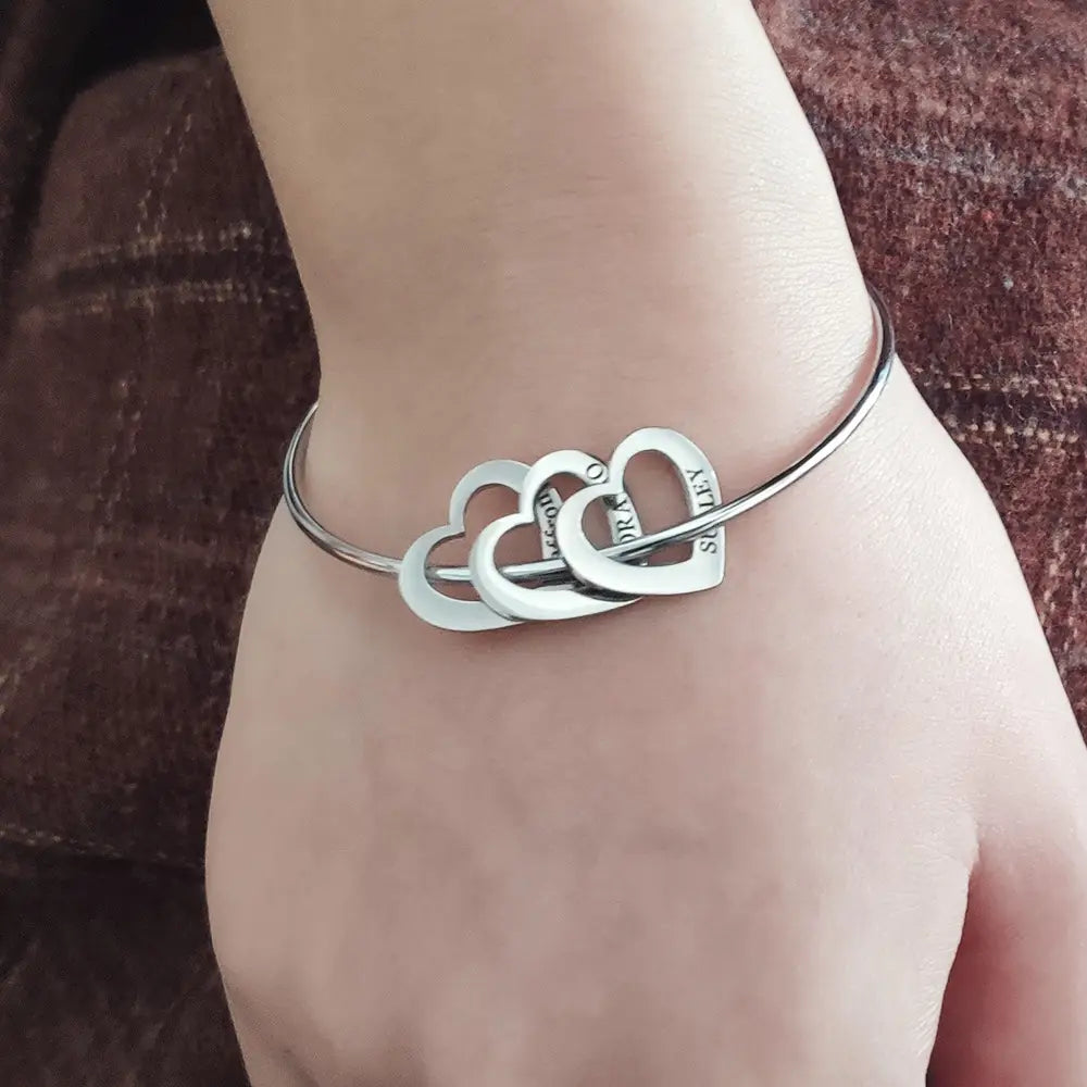 Silver heart-shaped charm bracelet in the Love Bracelet Peach Heart jewelry collection.