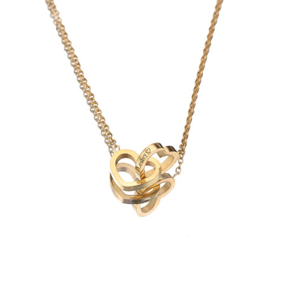 Gold stainless steel custom engraved necklace with interlocking heart pendants.