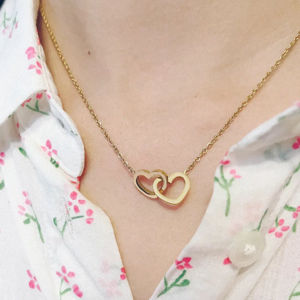 Gold interlocking heart necklace with custom engraved stainless steel double heart pendants