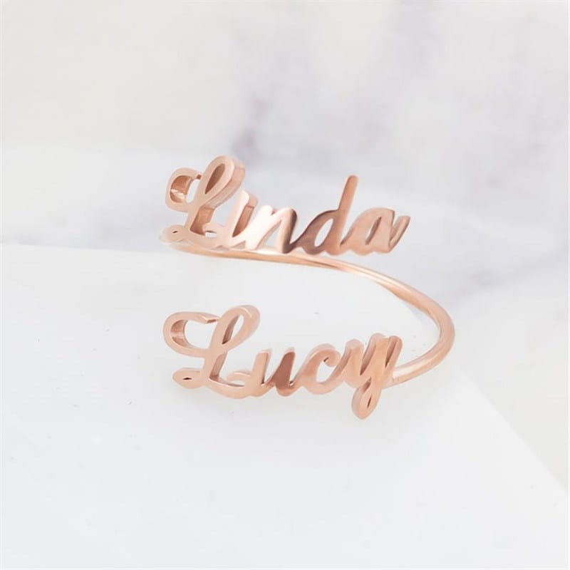 Customizable Rose Gold Name Ring with Laser Engraving and Adjustable Size in 316L Stainless Steel.