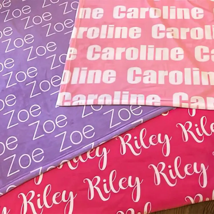 Personalized Name Blanket in Pink, Purple, and Fuchsia featuring vivid printing for infants.