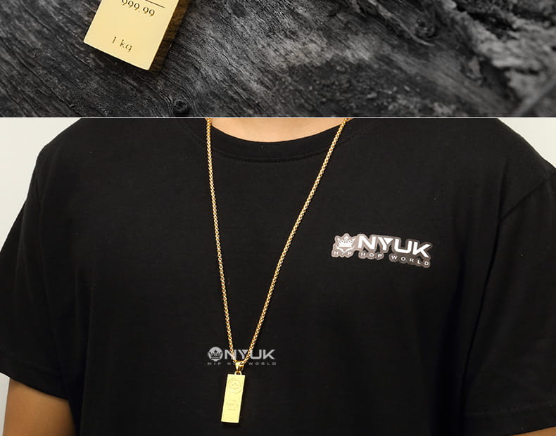 Gold chain necklace with rectangular pendant for trendy jewelry lovers.