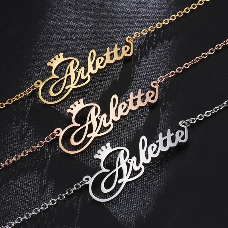 Gold Nameplate Necklaces with Crown, perfect for personalized style in stainless steel.