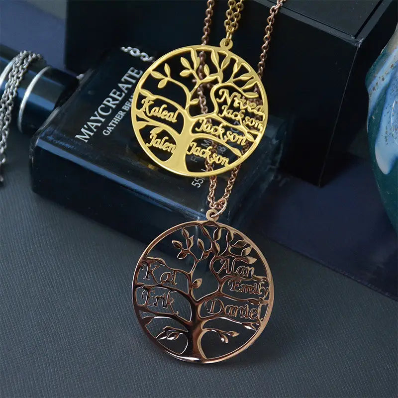 Two personalized Tree Of Life Multi-Name Design Family Necklaces in Gold Titanium Steel.