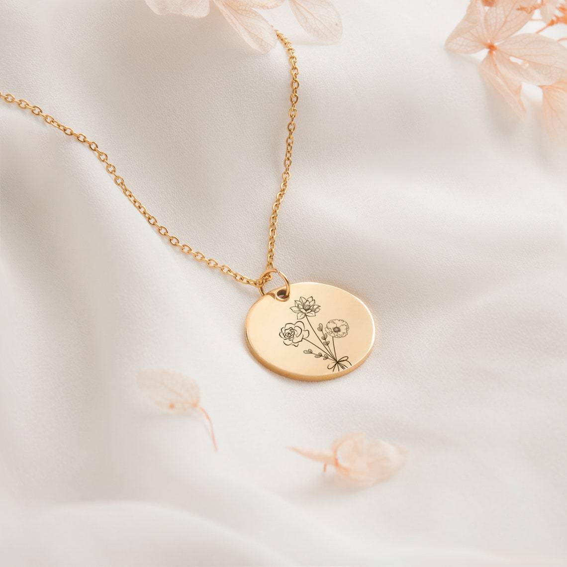 Gold necklace with floral engraving from Combination Birthday Flowers Personalized Flower Necklace.