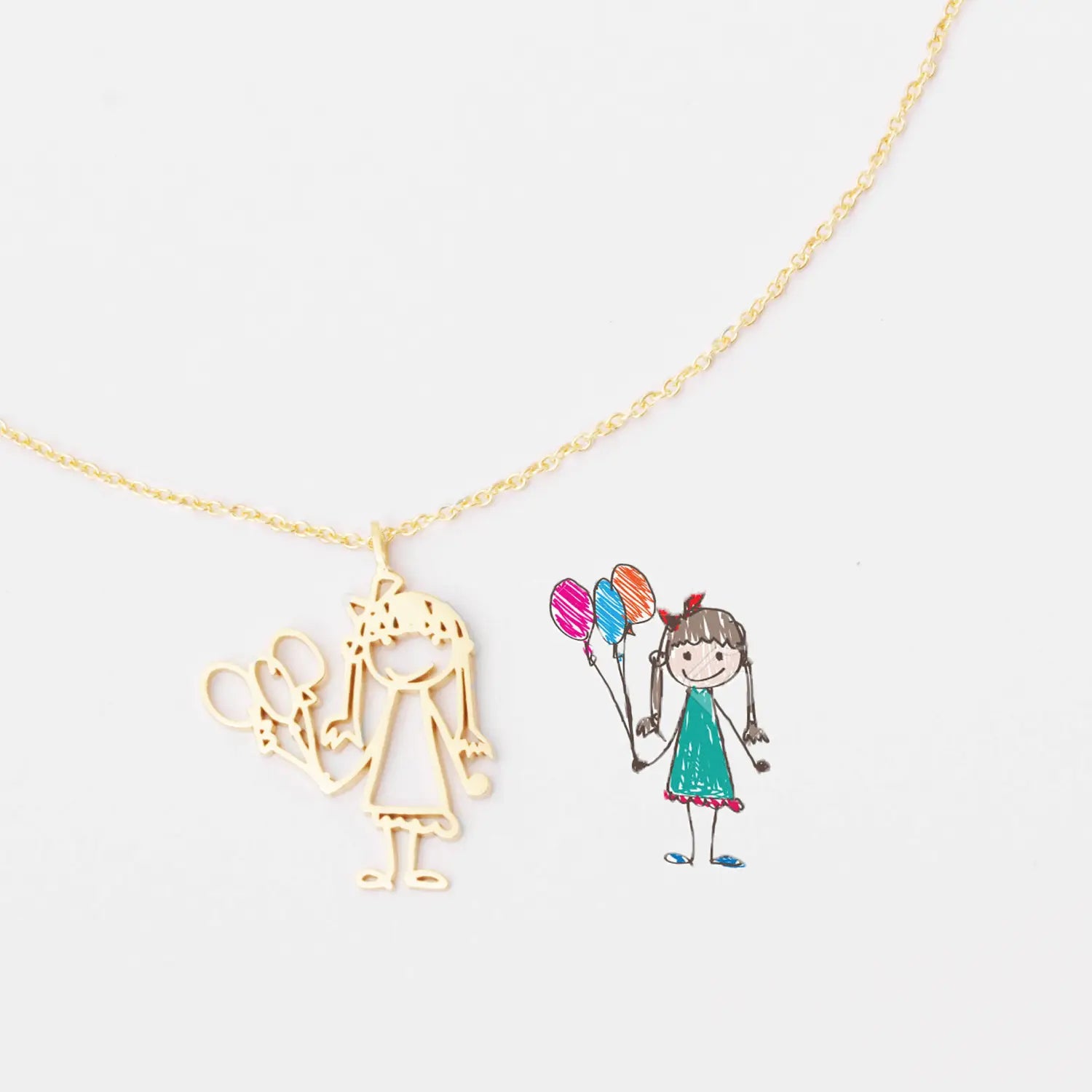 Gold necklace with girl pendant featuring a baby hand drawing design in durable chain material