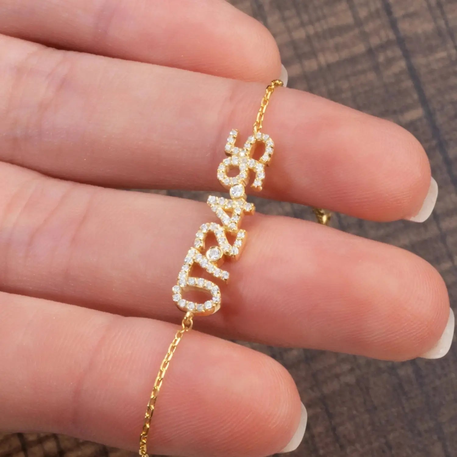 Gold-Toned Diamond Digital Bracelet featuring diamond-studded customizable numbers for DIY personalization.