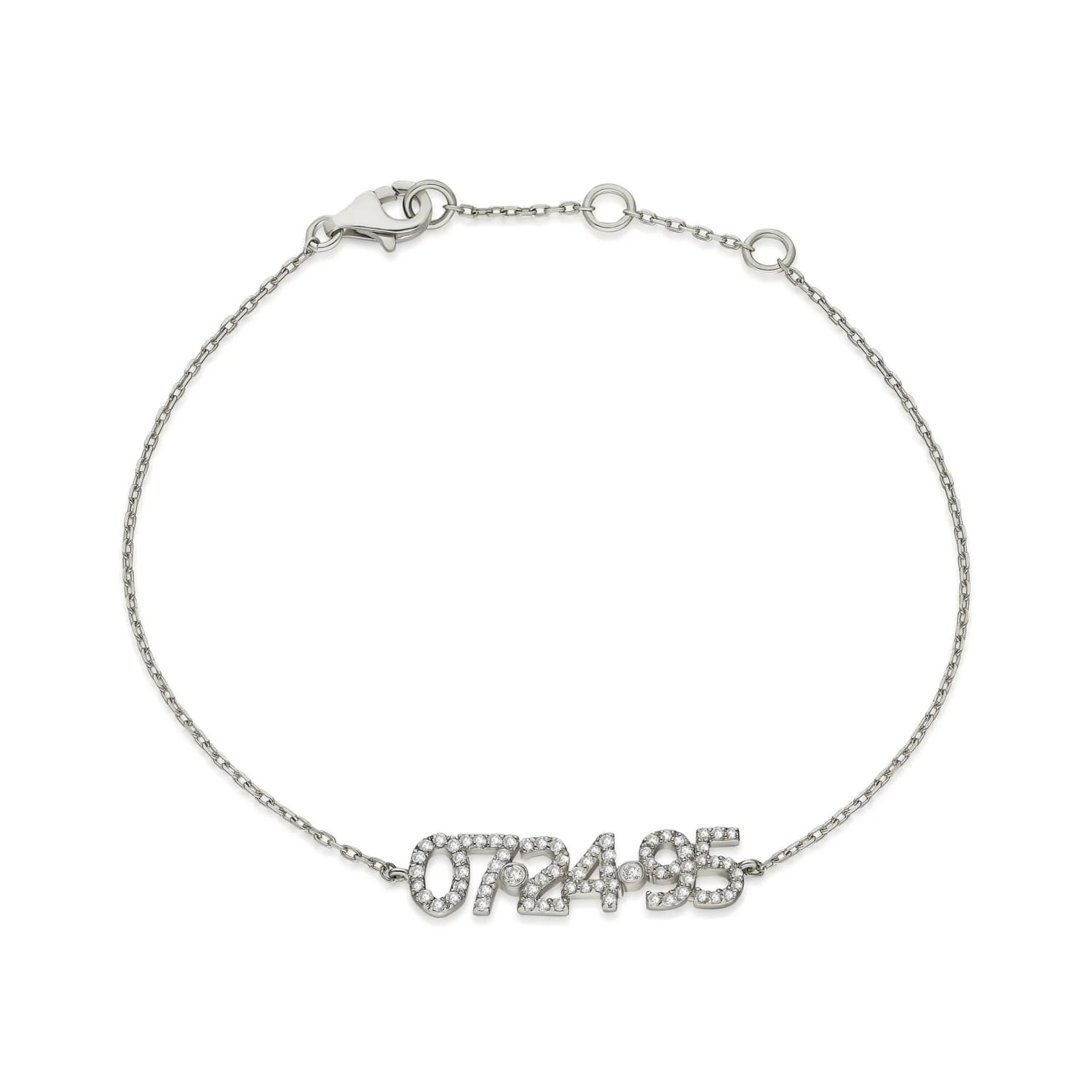Silver bracelet with diamond-studded date for a DIY personalized digital bracelet.